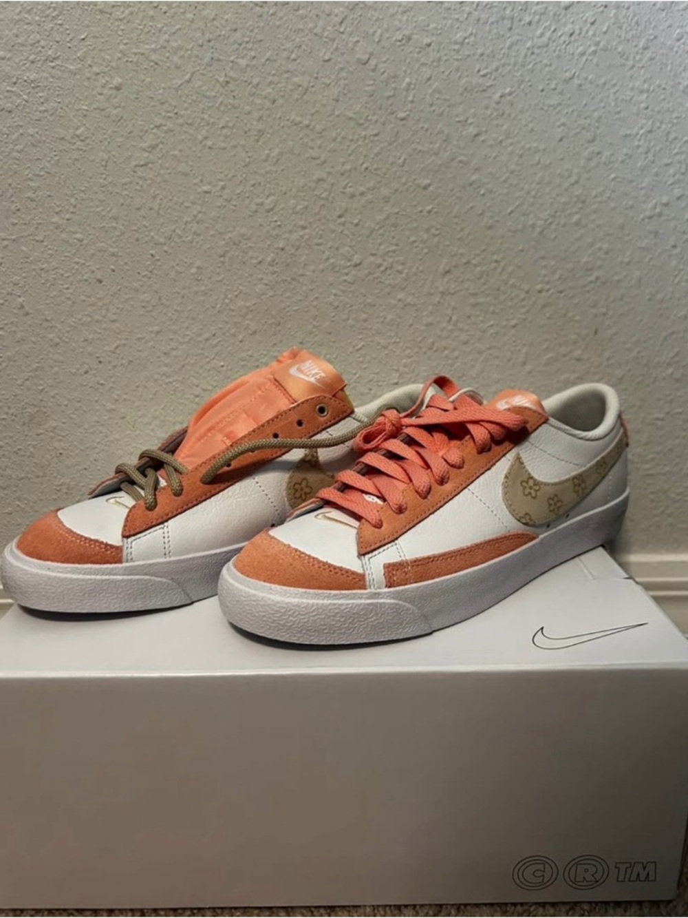 Nike Low-Top Sneakers in Peach and White with Gold Floral Swoosh